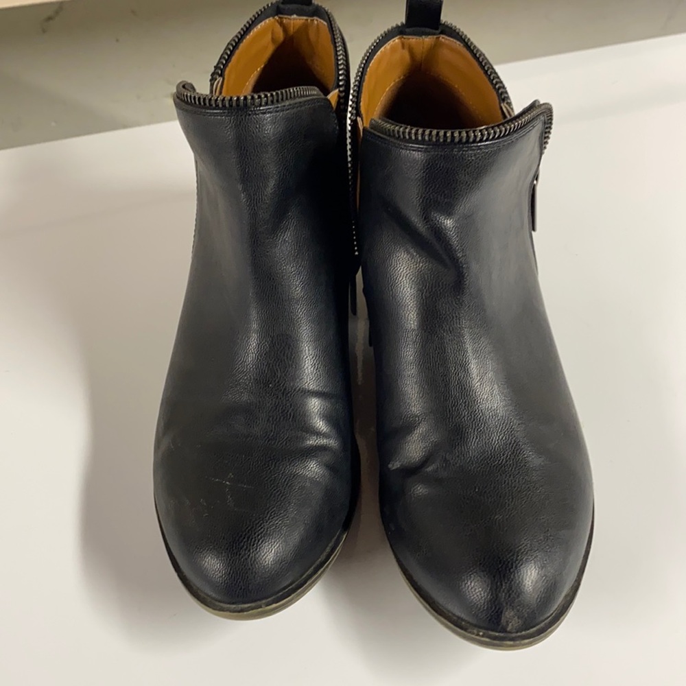 Black faux leather ankle booties.